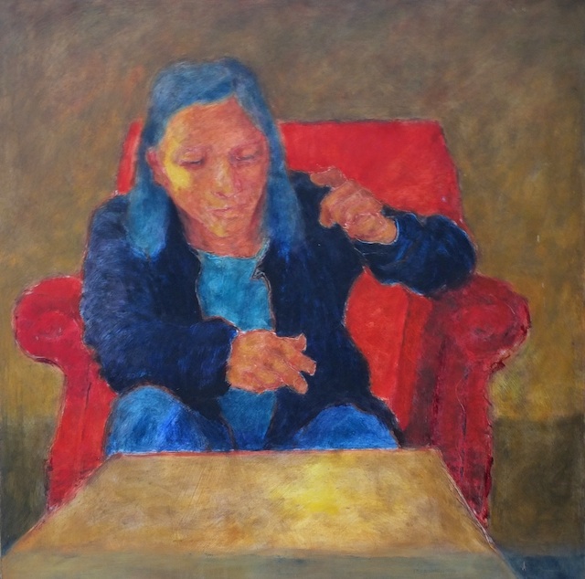 Woman in a red armchair